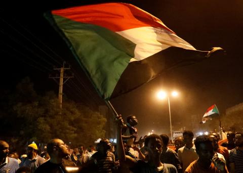 Sudanese people, seeking to revive a push for civilian rule in ongoing tumult since the overthrow of former President Omar al-Bashir more than two months ago, chant slogans and wave Sudanese flags during a demonstration in Khartoum, Sudan, June 21, 2019. PHOTO BY REUTERS/Umit Bektas