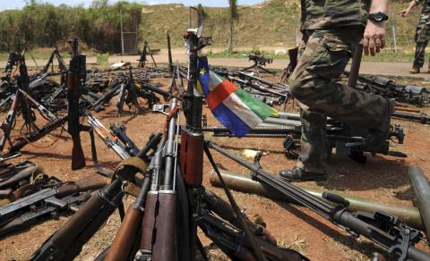 A Central African Republic flag is seen on a gun, which is diplayed among other arms confiscated from ex-Seleka rebels and "anti-balaka" militia by the French military of Operation Sangaris at a French military base in Bangui