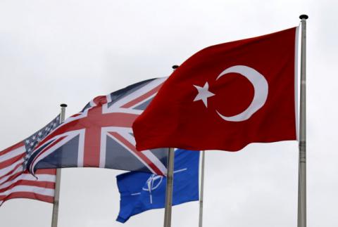 A Turkish flag (R) flies among others flags of NATO members during the North Atlantic Council (NAC) at the Alliance headquarters in Brussels, Belgium, July 28, 2015. PHOTO BY REUTERS/Francois Lenoir