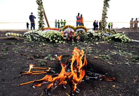 Candle flames burn during a commemoration ceremony for the victims at the scene of the Ethiopian Airlines Flight ET 302 plane crash, near the town Bishoftu, near Addis Ababa, Ethiopia, March 14, 2019. PHOTO BY REUTERS/Tiksa Negeri