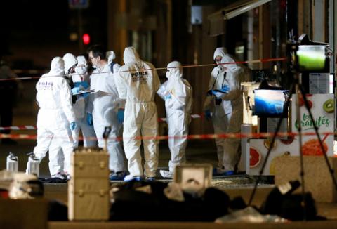 Forensic officers inspect the site of a suspected bomb attack in central Lyon, France, May 24, 2019. PHOTO BY REUTERS/Emmanuel Foudrot