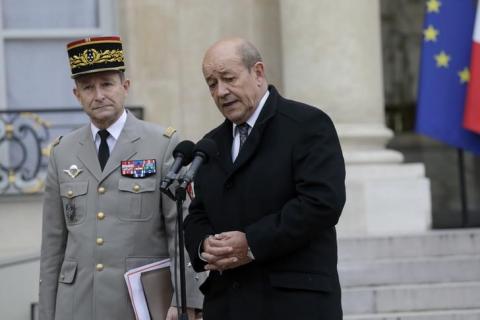 French Defence Minister Jean-Yves Le Drian (R) stands beside French Army Chief of Staff General Pierre Le Jolis de Villiers de Saintignon as they speak to journalists after a crisis meeting at the Elysee Palace in Paris, January 12, 2015. REUTERS/Philippe Wojazer