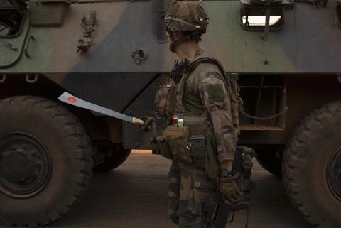 A French peacekeeping soldier holds a confiscated machete in the centre of the capital Bangui 