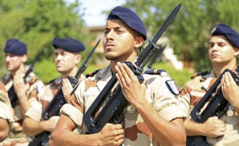 French soldiers stand at attention during a morning drill at the French military base in Chadian capital N?Djamena, October 26, 2014. PHOTO BY REUTERS/Emma Farge