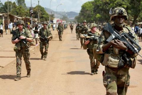 French soldiers patrol on foot in Bangui December 8, 2013. France is deploying 1,600 troops to its former colony after the U.N. Security Council on Thursday authorised it to use force to help African peacekeepers struggling to restore order. PHOTO BY REUTERS/Herve Serefio