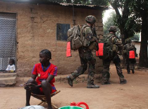 French soldiers conduct a daytime patrol in a neighbourhood in Bangui, after shooting continued overnight in the capital
