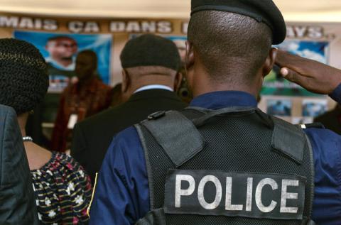 A policeman salutes as Congolese opposition leader Etienne Tshisekedi and his wife Marthe arrive to pay their last respects in front the coffins containing the bodies of protesters killed during the September 19 and 20 demonstrations in Limete, Kinshasa, Democratic Republic of Congo, November 1, 2016. PHOTO BY REUTERS/Robert Carrubba