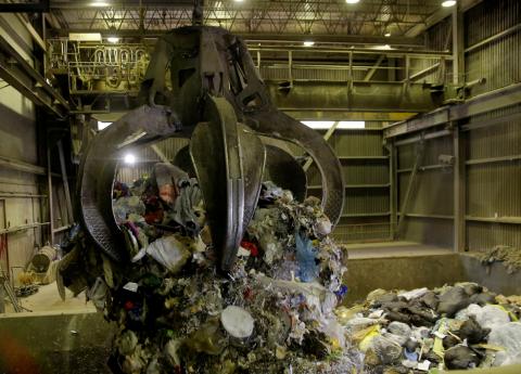 Garbage is dropped from a grappler into a hopper, where it will be fed into a combustion chamber and incinerated at the Vancouver Waste-To-Energy garbage facility where garbage shipped from the Philippines will be processed, in Burnaby, British Columbia, Canada, June 17, 2019. PHOTO BY REUTERS/Lindsey Wasson