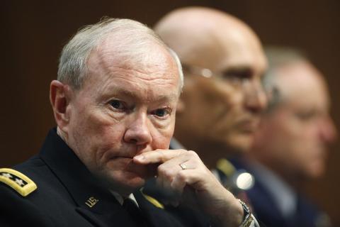 Chairman of the Joint Chiefs of Staff U.S. Army General Martin Dempsey listens to testimonies from fellow service chiefs during a Senate Armed Services Committee hearing on Defense Department proposals relating to military compensation, on Capitol Hill in Washington