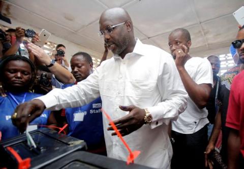 George Weah, former soccer player and presidential candidate of Congress for Democratic Change (CDC), votes at a polling station in Monrovia, Liberia, October 10, 2017. PHOTO BY REUTERS/Thierry Gouegnon