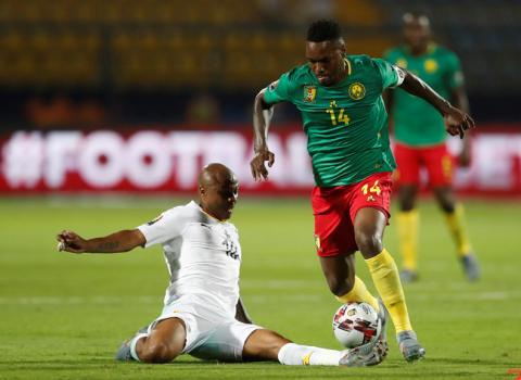 Cameroon's Georges Mandjeck in action with Ghana's Andre Ayew. PHOTO BY REUTERS/Amr Abdallah Dalsh