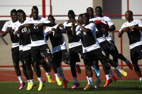 Ghana's national soccer team players sing and dance during a training session ahead of their 2014 World Cup against Portugal in Brasilia