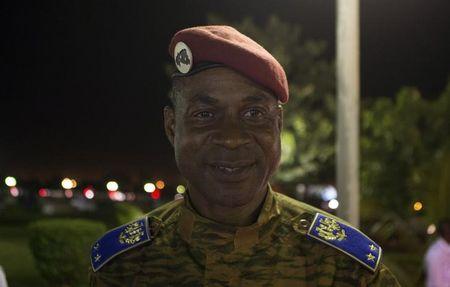 Head of Burkina Faso's presidential guard Gilbert Diendere waits for his chauffeur to arrive after the swearing-in ceremony of newly named President Michel Kafondo in Ouagadougou, November 21, 2014. PHOTO BY REUTERS/Joe Penney