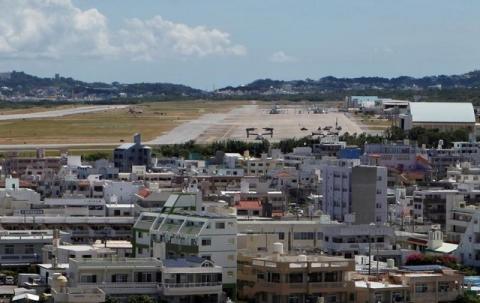 Osprey military aircraft are seen at the U.S. Futenma airbase in Ginowan, on the southern Japanese island of Okinawa, July 26, 2013. PHOTO BY REUTERS/Nathan Layne