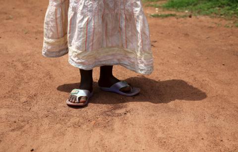 A girl walks at her grandmother's home in rural Uganda, April 14, 2015. PHOTO BY REUTERS/Katy Migiro