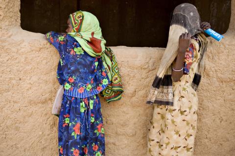 Refugee girls who fled conflict in Sudan's western Darfur region stand outside a classroom at Djabal camp near Gos Beida in eastern Chad, June 11, 2008. PHOTO BY REUTERS/Finbarr O'Reilly 