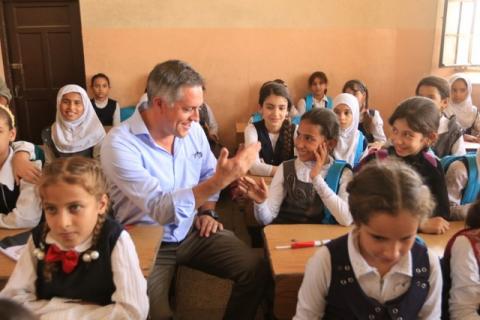 Ambassador of the European Union to Iraq, Patrick Simonnet speaks with Iraqi girls in a school during his visit to Mosul, Iraq, July 18, 2017. PHOTO BY REUTERS/Ari Jalal