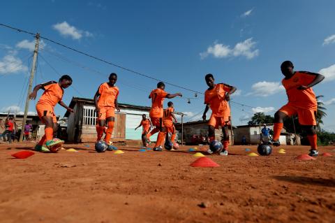 Ida Daniela Pouadjeu (L), 16, a soccer player, attends her training session with her U17 team, who are amongst the first wave of girls being trained by professional coaches at the Rails Foot Academy at the Rail's field in Yaounde, Cameroon May 2, 2019. Pouadjeu is angry about people's attitude towards female soccer players. PHOTO BY REUTERS/Zohra Bensemra