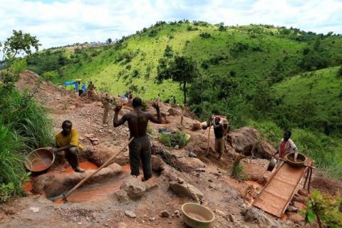 Gold miners work at an open-pit gold mine in Lukingi village in Mubende district, about 150 km (90 miles) southwest of Uganda's capital Kampala. PHOTO BY REUTERS/James Akena