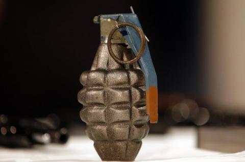 A hand grenade is displayed at a news conference at City Hall in New York. PHOTO BY REUTERS/Mike Segar