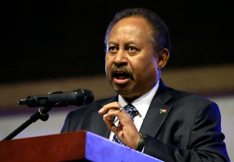 Sudan's Prime Minister in the transitional government Abdalla Hamdok addresses people as they celebrate the first anniversary of the start of the uprising that toppled long-time ruler Omar al-Bashir, at the Friendship Hall in Khartoum, Sudan, December 25, 2019. PHOTO BY REUTERS/Mohamed Nureldin Abdallah