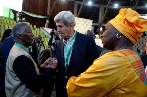 Former U.S. Secretary of State John Kerry and former South Africa President Thabo Mbeki, observers for the general election in Kenya, greet each other next to former Senegalese Prime Minister Aminata Toure in a tally centre in Nairobi, Kenya, early August 9, 2017. PHOTO BY REUTERS/Thomas Mukoya