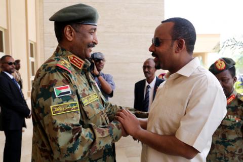 Ethiopian Prime Minister Abiy Ahmed meets Sudan's Head Of Transitional Military Council, Lieutenant General Abdel Fattah Al-Burhan Abdelrahman to mediate in the political crisis that has followed the overthrow of President Omar al-Bashir at the airport in Khartoum, Sudan, June 7, 2019. PHOTO BY REUTERS/Mohamed Nureldin Abdallah