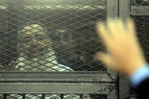 Egypt's Salafi leader and former presidential candidate Hazem Salah Abu Ismail looks on from the defendant cage during his trial in Cairo