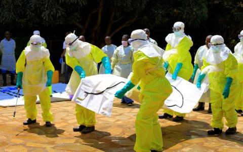 Congolese officials and the World Health Organization officials wear protective suits as they participate in a training against the Ebola virus near the town of Beni in North Kivu province of the Democratic Republic of Congo, August 11, 2018. PHOTO BY REUTERS/Samuel Mambo