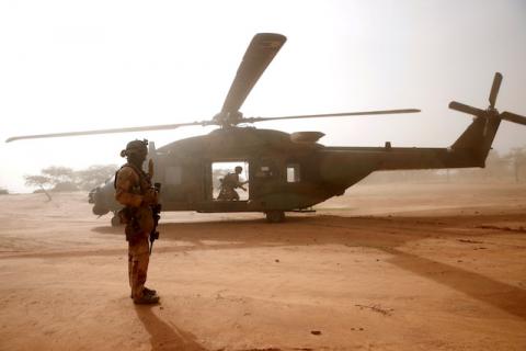 A French soldier stands guards in front of an NH90 Caiman military helicopter during Operation Barkhane in Ndaki, Mali, July 29, 2019. PHOTO BY REUTERS/Benoit Tessier