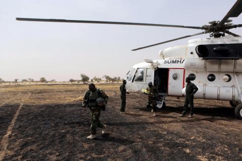 Colonel Barmou Salaou (L), commander of Niger's armed forces in the Diffa region, lands in Damasak, March 24, 2015. PHOTO BY REUTERS/Joe Penney