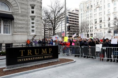 Activists gather outside the Trump International Hotel to protest President Donald Trump's executive actions on immigration in Washington, DC, U.S. on January 29, 2017. PHOTO BY REUTERS/Aaron P. Bernstein