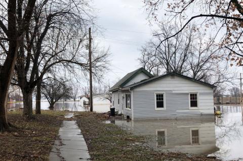 Homes sit in flood waters after leaving casualities and causing hundreds of millions of dollars in damages, with waters yet to crest in parts of the U.S. midwest, in Peru, Nebraska, U.S., March 19, 2019. PHOTO BY REUTERS/Karen Dillon