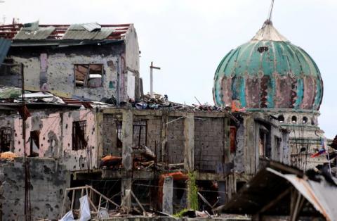 Damaged houses and buildings are seen after government troops cleared the area from pro-Islamic State militant groups inside the war-torn area in Saduc proper, Marawi city, southern Philippines, October 22, 2017. PHOTO BY REUTERS/Romeo Ranoco