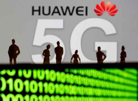 Small toy figures are seen in front of a displayed Huawei and 5G network logo in this illustration picture, March 30, 2019. PHOTO BY REUTERS/Dado Ruvic/Illustration