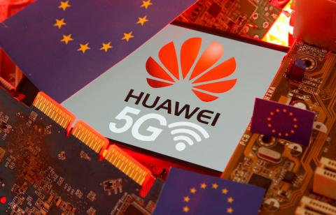 The EU flag and a smartphone with the Huawei and 5G network logo are seen on a PC motherboard in this illustration taken January 29, 2020. PHOTO BY REUTERS/Dado Ruvic