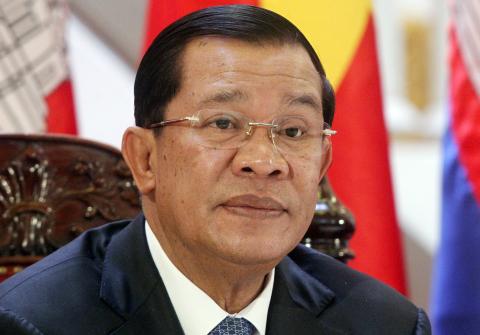 Cambodia's Prime Minister Hun Sen attends a signing ceremony at the Government Office in Hanoi