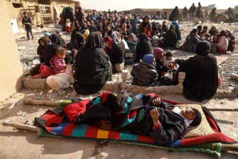 A displaced Iraqi woman who just fled her home lies down at Special forces base as she waits to be transported to the refugees camp while Iraqi forces battle with Islamic State militants in western Mosul, Iraq, February 27, 2017. PHOTO BY REUTERS/Zohra Bensemra