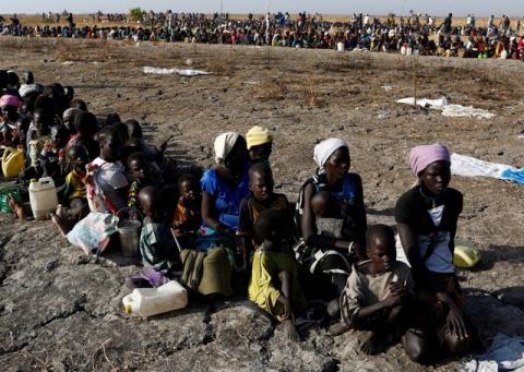 Women and children wait to be registered prior to a food distribution carried out by the United Nations World Food Programme (WFP) in Thonyor, Leer state, South Sudan, February 26, 2017. PHOTO BY REUTERS/Siegfried Modola