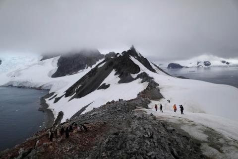 People walk along Orne Harbour, Antarctica, February 6, 2020. PHOTO BY REUTERS/Ueslei Marcelino