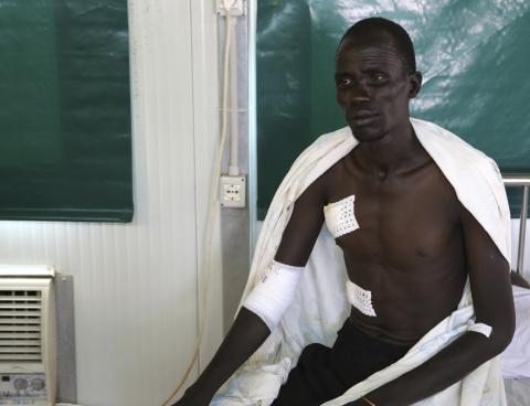 An injured civilian rests at a medical clinic inside the United Nations compound on the outskirts of the capital Juba in South Sudan