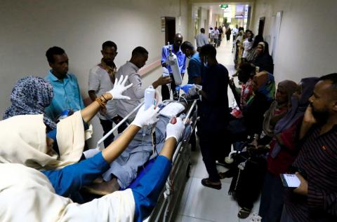 A Sudanese protester, injured when violence broke out over an agreement on a political transition reached by Sudan's ruling military council generals and protest groups, receives treatment at Moalem Medical City Hospital in Khartoum, Sudan, May 14, 2019. PHOTO BY REUTERS/Mohamed Nureldin Abdallah