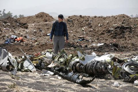 American civil aviation and Boeing investigators search through the debris at the scene of the Ethiopian Airlines Flight ET 302 plane crash, near the town of Bishoftu, southeast of Addis Ababa, Ethiopia, March 12, 2019. PHOTO BY REUTERS/Baz Ratner