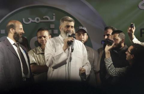 Leading member of the Islamic Jama'a Assem Abdel Maged (C) speaks during a protest by islamists, members of the brotherhood, and supporters of Egyptian former President Mohamed Mursi