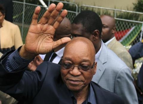 South Africa's President Jacob Zuma waves after addressing mourners outside the residence of former South African President Nelson Mandela in Johannesburg, December 6, 2013. PHOTO BY REUTERS/Siphiwe Sibeko