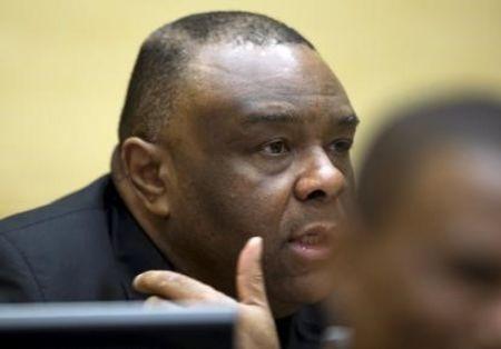 Former Congo vice-president Jean-Pierre Bemba looks up when sitting in the courtroom of the International Criminal Court to stand trial with Aime Kilolo Musamba, Jean-Jacques Mangenda Kabongo, Fidele Babala Wandu and Narcisse Arido in The Hague, Netherlands, September 29, 2015. PHOTO BY REUTERS/Peter Dejong