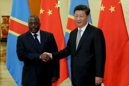 China's President Xi Jinping (R) shakes hands with Democratic Republic of the Congo's President Joseph Kabila at the Great Hall Of The People in Beijing, China, September 4, 2015. PHOTO BY REUTERS/Lintao Zhang