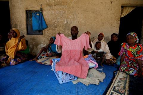 Kachalla Bukar, father of Aisha Kachalla, a missing student of Government Girls Science and Technical College, holds a dress of her daughter in Dapchi, in the northeastern state of Yobe, Nigeria, February 23, 2018. PHOTO BY REUTERS/Afolabi Sotunde