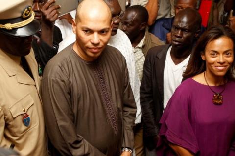 Karim Wade (2nd L) and Sindiely Wade (R), children of Senegal's former President Abdoulaye Wade. PHOTO BY REUTERS/Youssef Boudlal