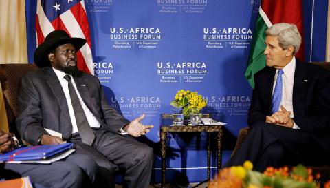 South Sudan's President Salva Kiir (L) talks with U.S. Secretary of State John Kerry as they hold a bilateral meeting at the U.S.-Africa Business Forum in Washington